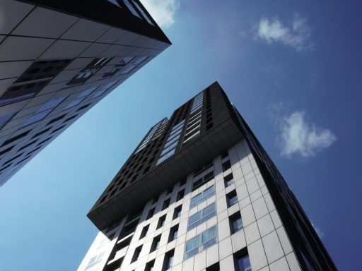 white and black concrete building under blue sky during daytime