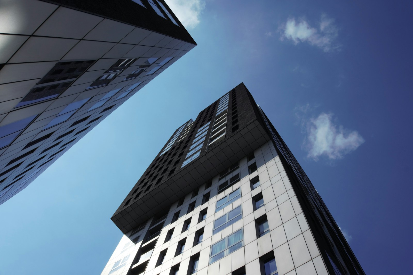 white and black concrete building under blue sky during daytime