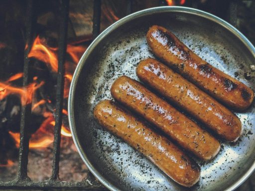 cooked sausage on round grey pan