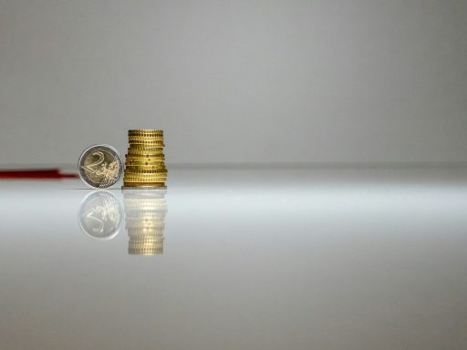 a stack of coins sitting on top of a table